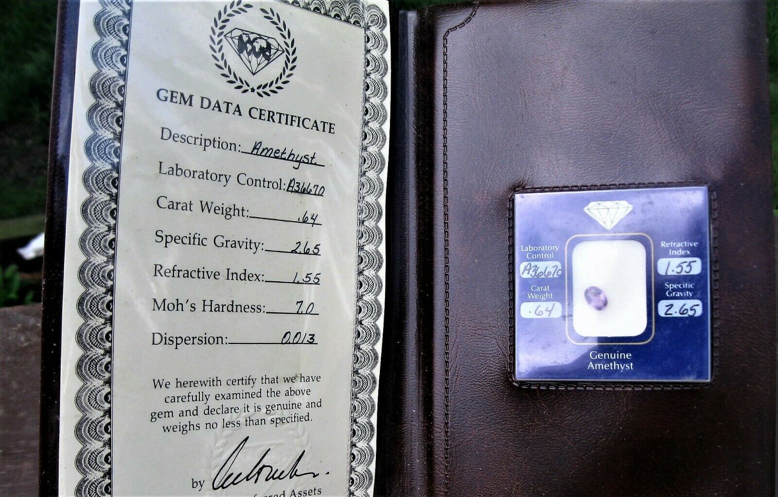 Amethyst Gemstone With Gem Data Certificate .64 Ctw In Faux Leather Wallet
